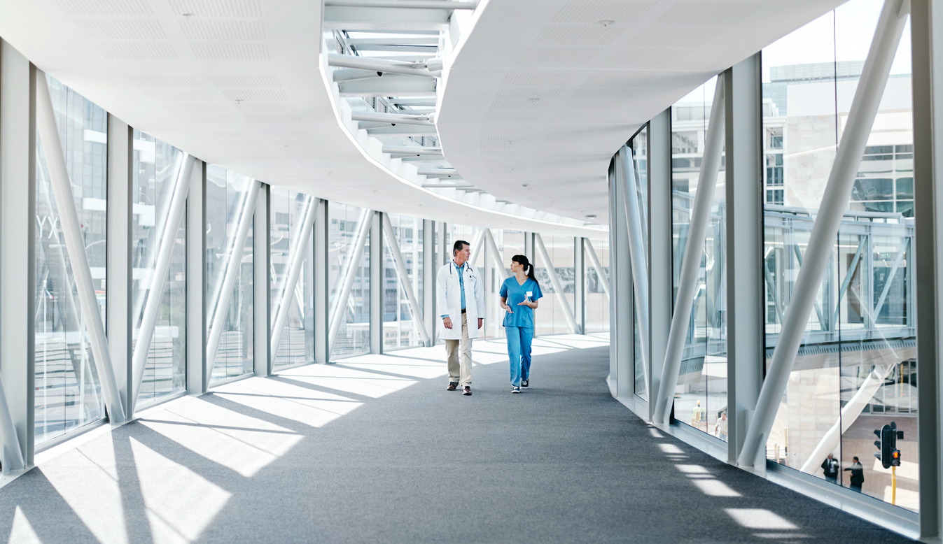 Shot of two healthcare workers walking together